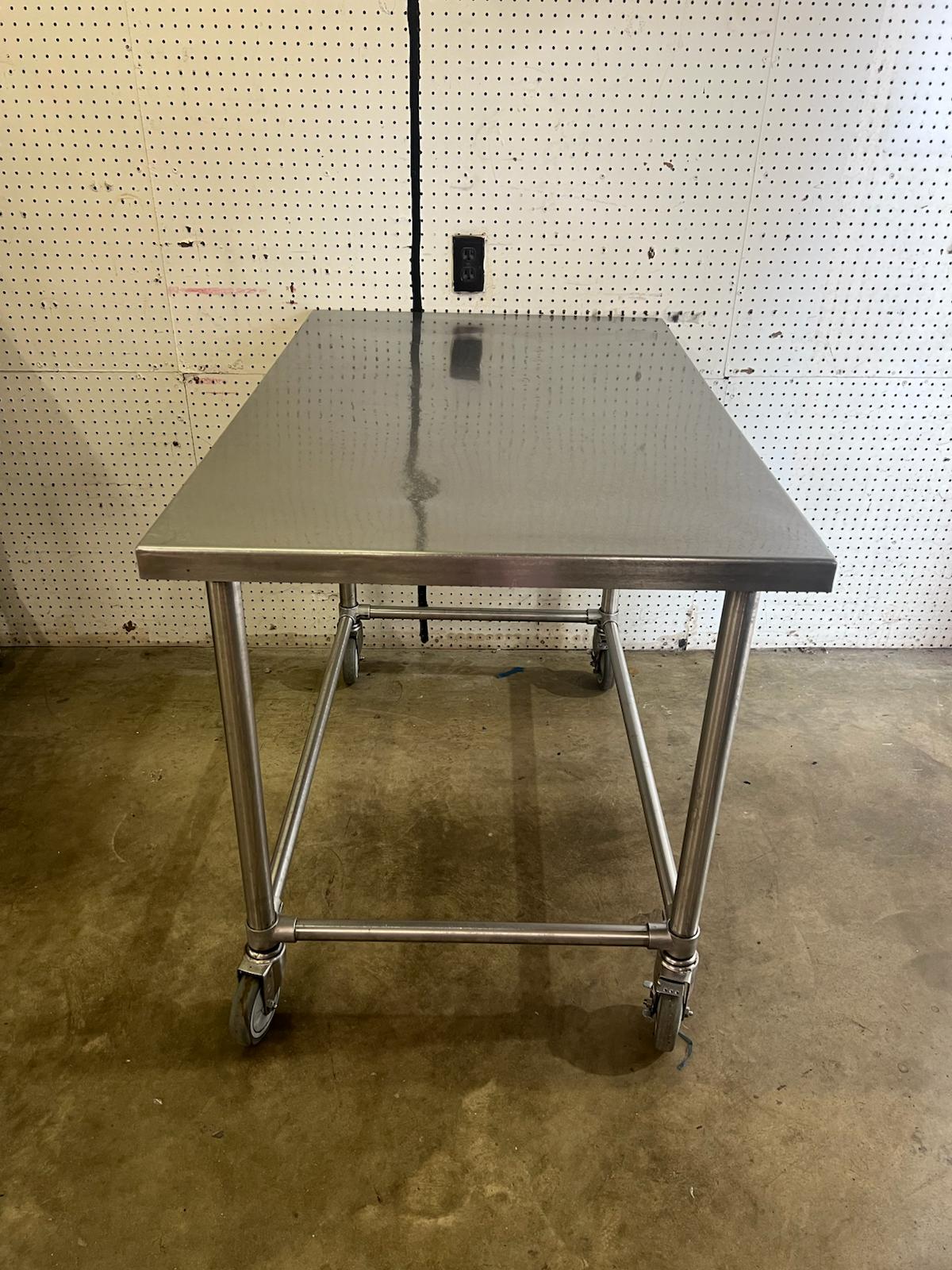 Used 48" X 30" Stainless Steel Table with Casters - WO1