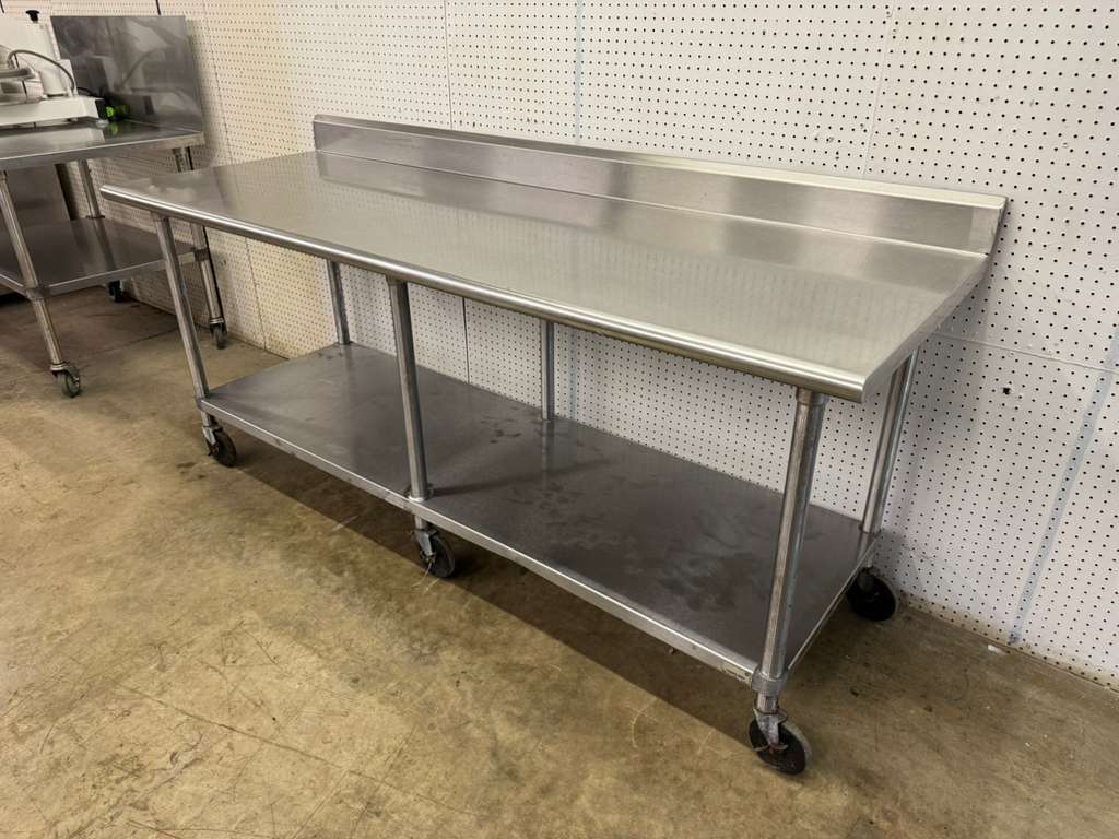Used Advance Tabco 84"x 30" Stainless Steel Table on Casters
