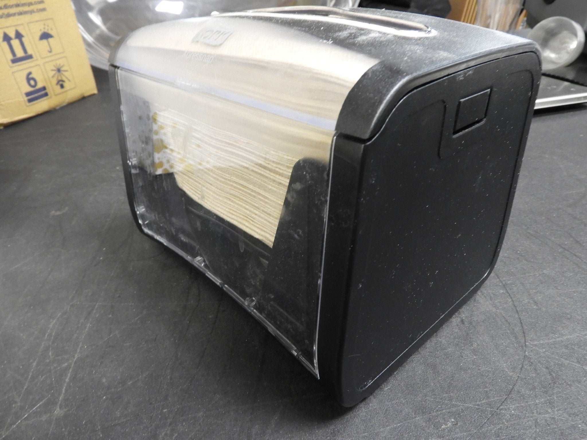 Used Tork Xpressnap Tabletop Napkin Dispenser, 7.9"W x 5.9"D x 6.1"H, Black - Falcon Restaurant Supply - 3
