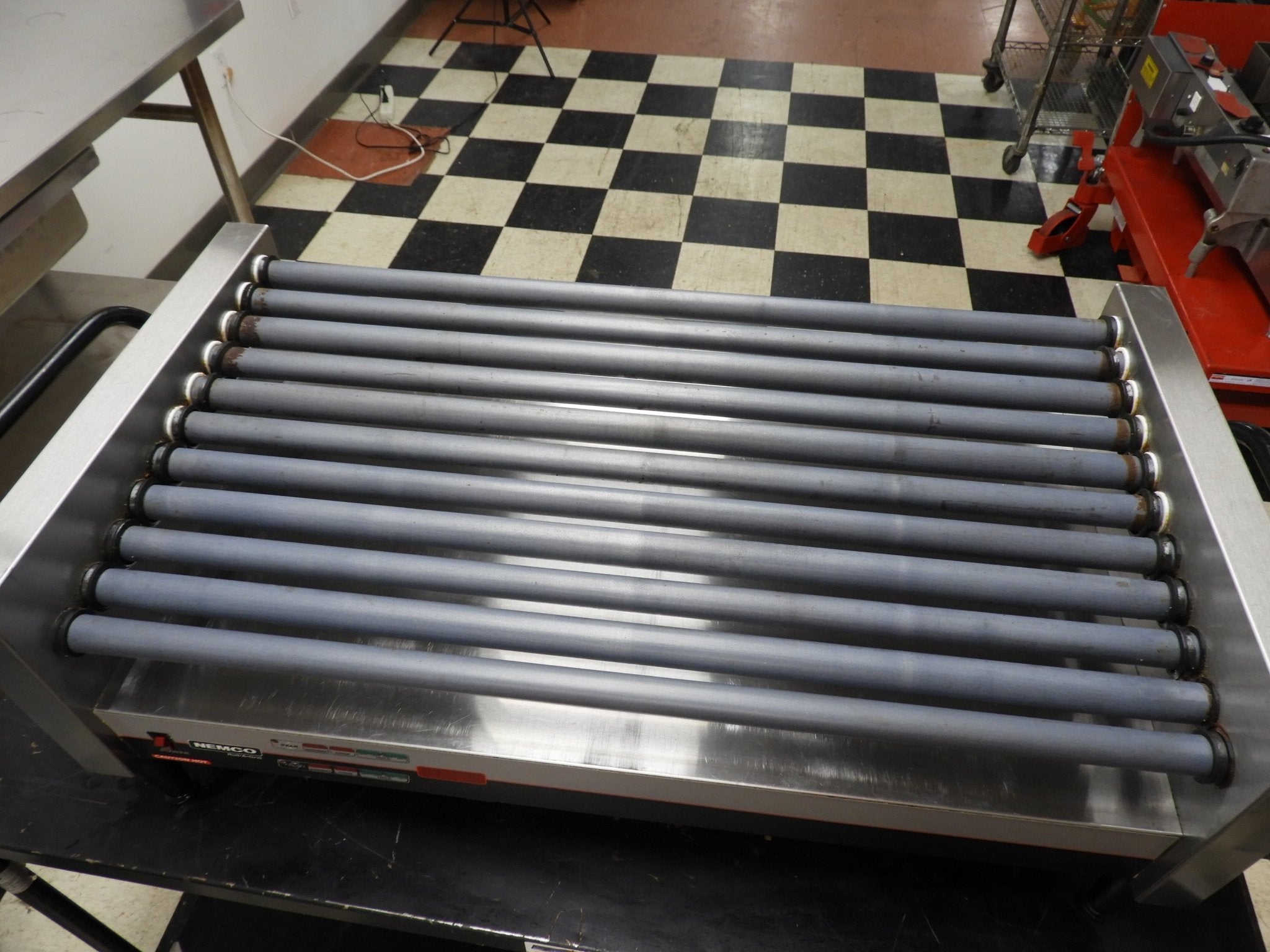 Used Nemco 8250 - SLT 50 Commercial Hot Dog Roller Grill - Slanted Top, 120v - Falcon Restaurant Supply - 1