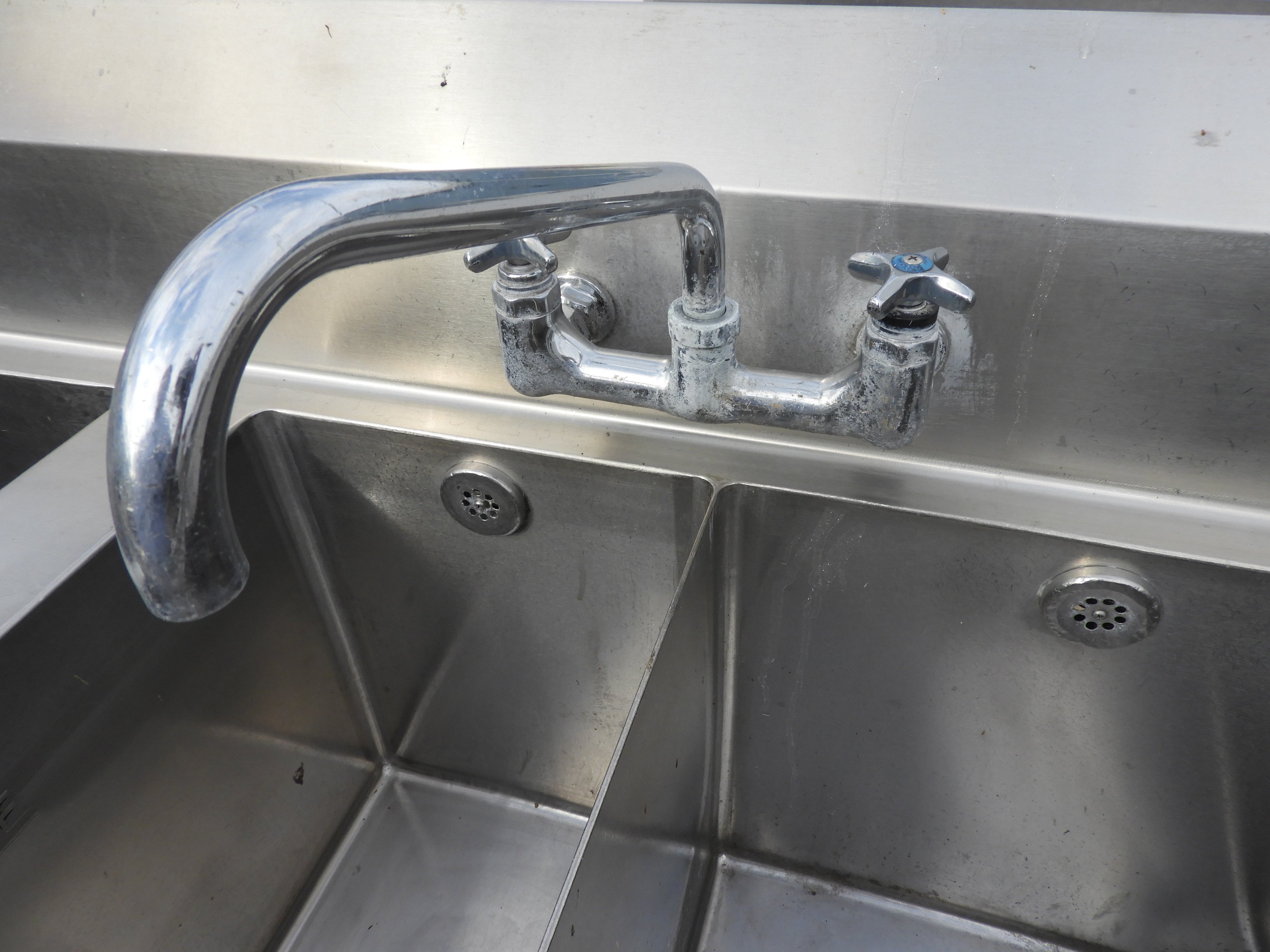 Used 3 Compartment Stainless Steel Commercial Sink with Twist Drains and X-Stream Wash - SS18
