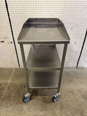 Used 18"x30" Stainless Steel Table with 3" Backsplash, Shelves and Casters - Falcon Restaurant Supply - 1