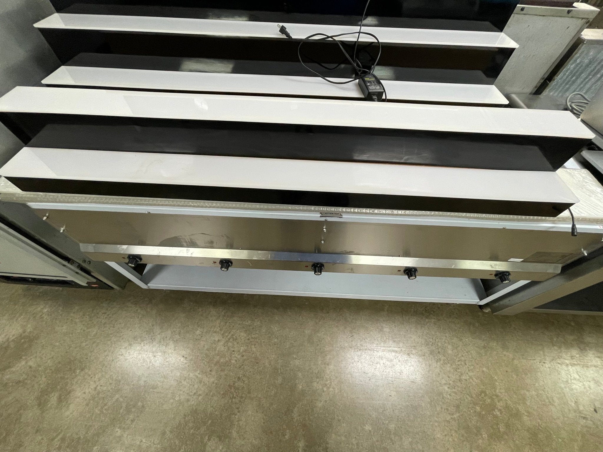 Used LED Baseline 60" 2 Tier LED Lighted Liquor Display Shelf 120V Black - Falcon Restaurant Supply - 1