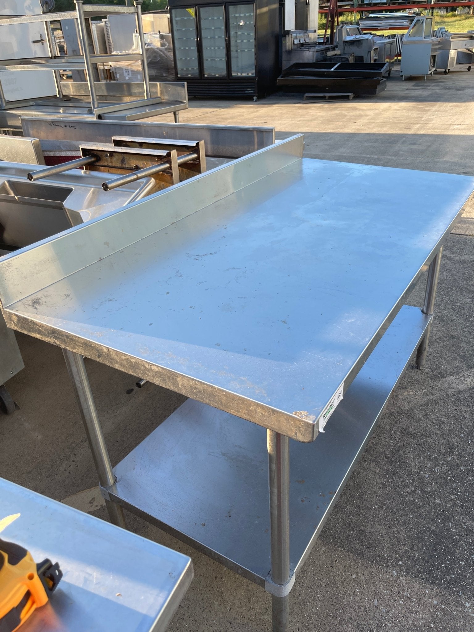 Used Regency 30"X60" Stainless Steel Table with Shelf and 4" Backsplash JD - SS322 - Falcon Restaurant Supply - 3
