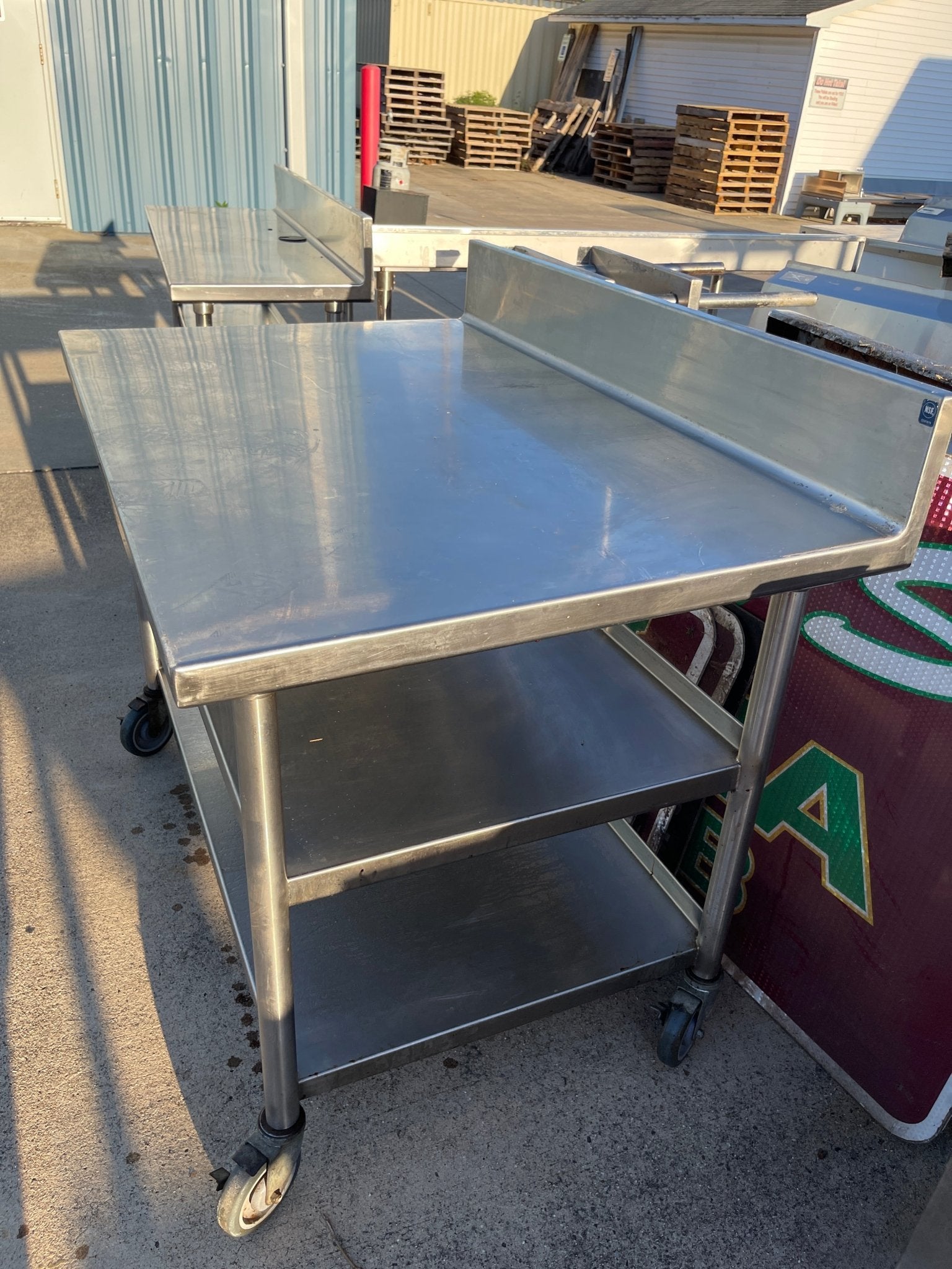 Used 48"x32" Heavy Stainless Table with Shelves, Casters and 6" Backsplash JD - SS324 - Falcon Restaurant Supply - 2