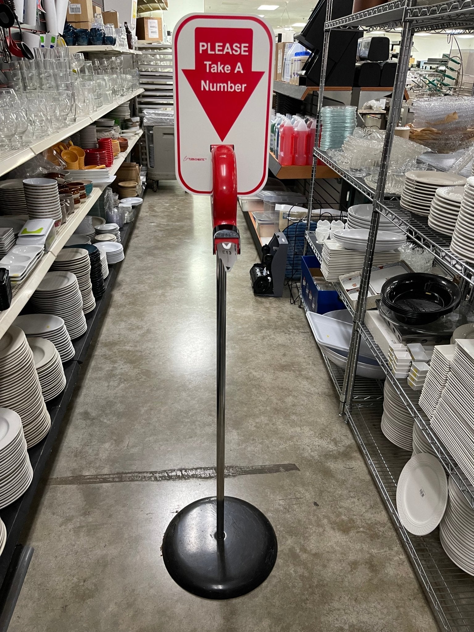 Used Microframe Turn - O - Matic Take A Number Ticket Dispenser with Floor Stand - Falcon Restaurant Supply - 1