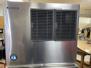 Stainless steel Hoshizaki ice machine in a warehouse setting