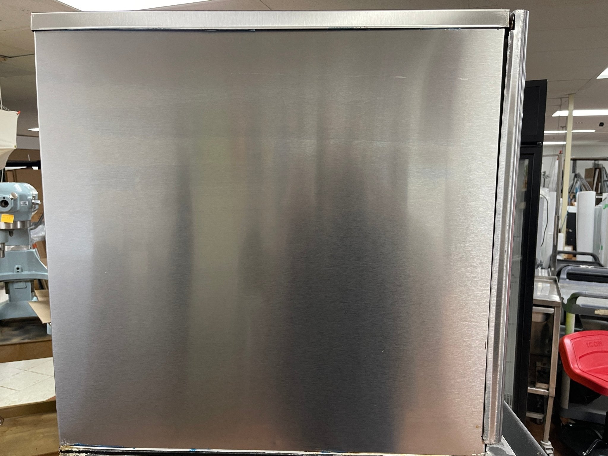 Side panel of an ice maker machine in a warehouse setting