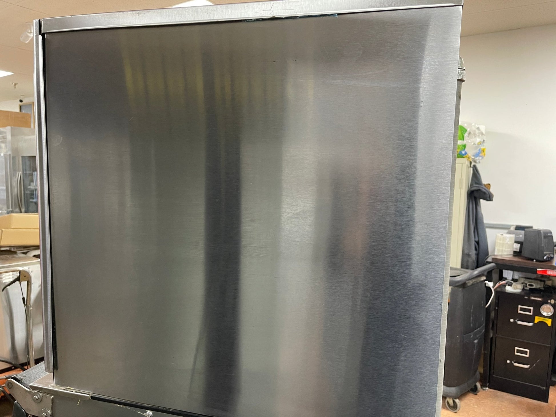 Side panel of an ice making machine