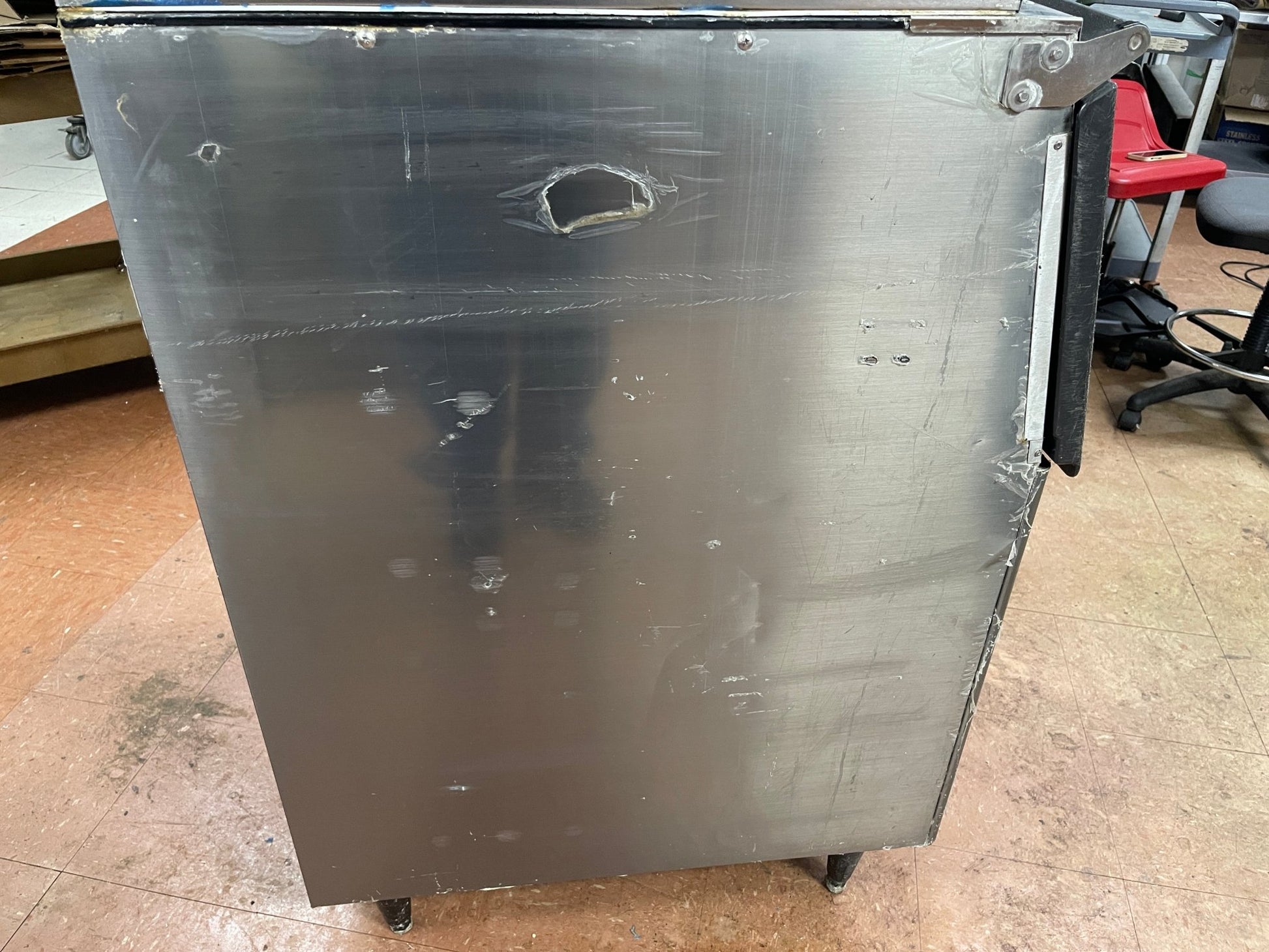 Silver metal side panel of an ice maker bin