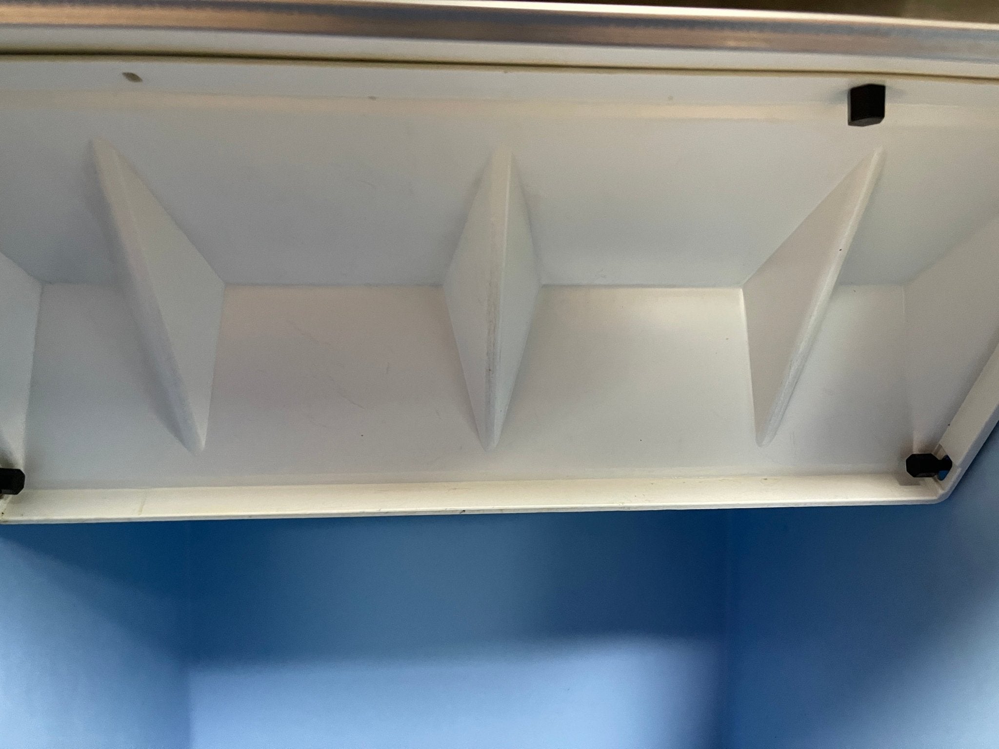 White lid of ice maker bin