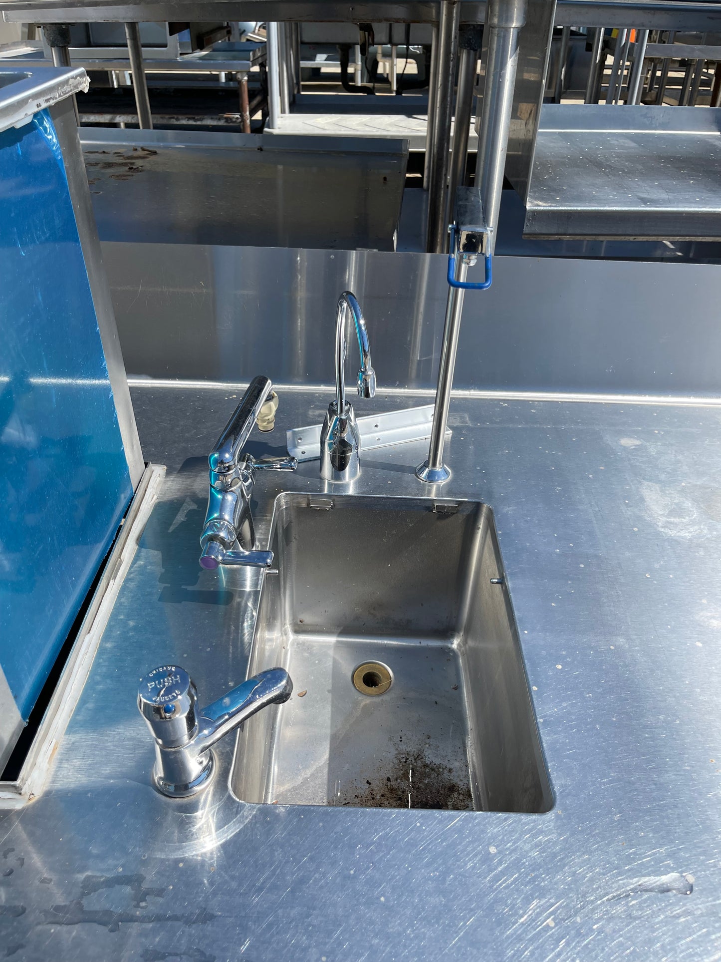 Used 136" Stainless Steel Counter with 2 Sink Compartments, Faucets and Ice Bin - SS5