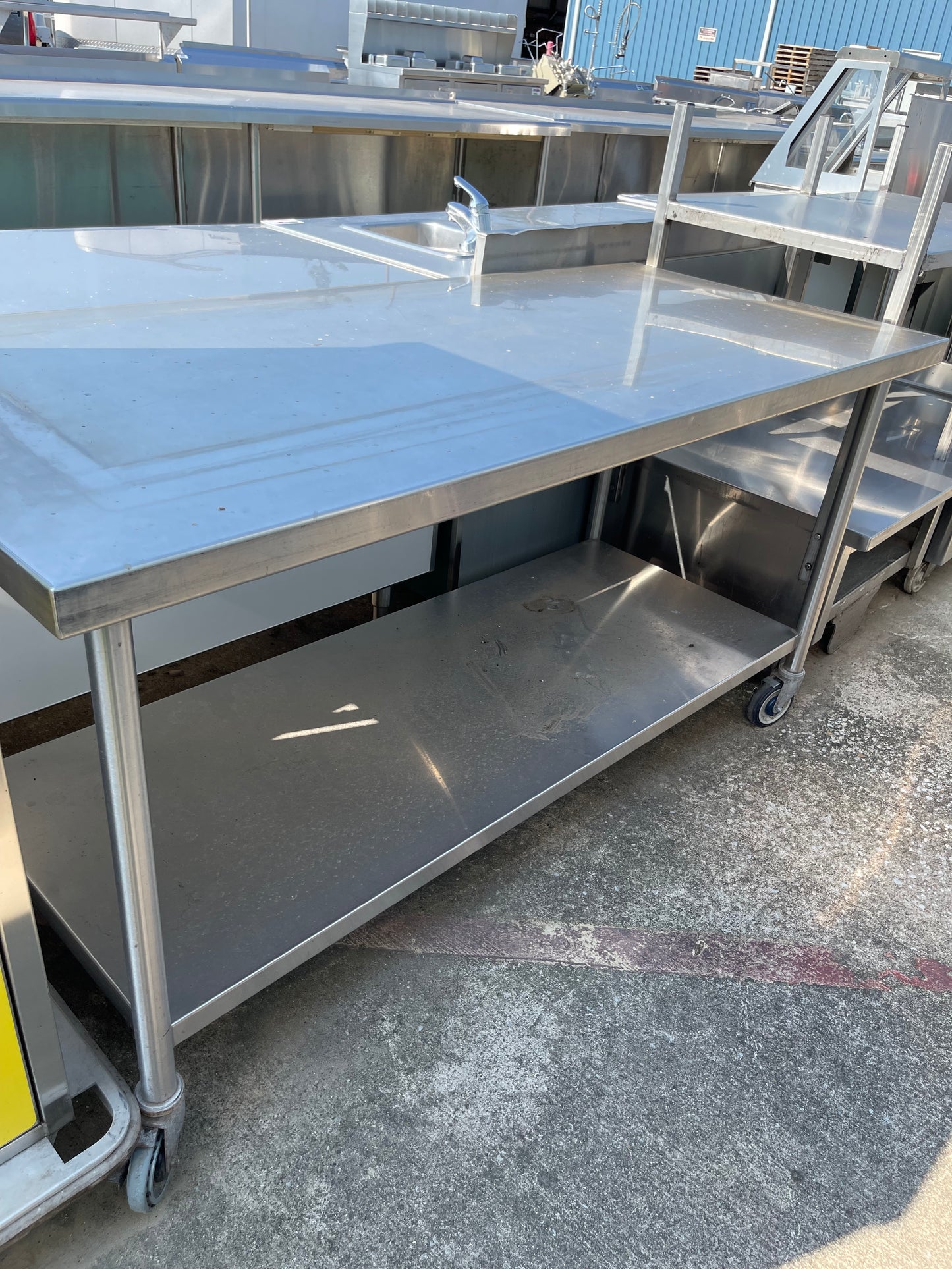 Used 69" Stainless Steel Table with Caster Wheels - SS116