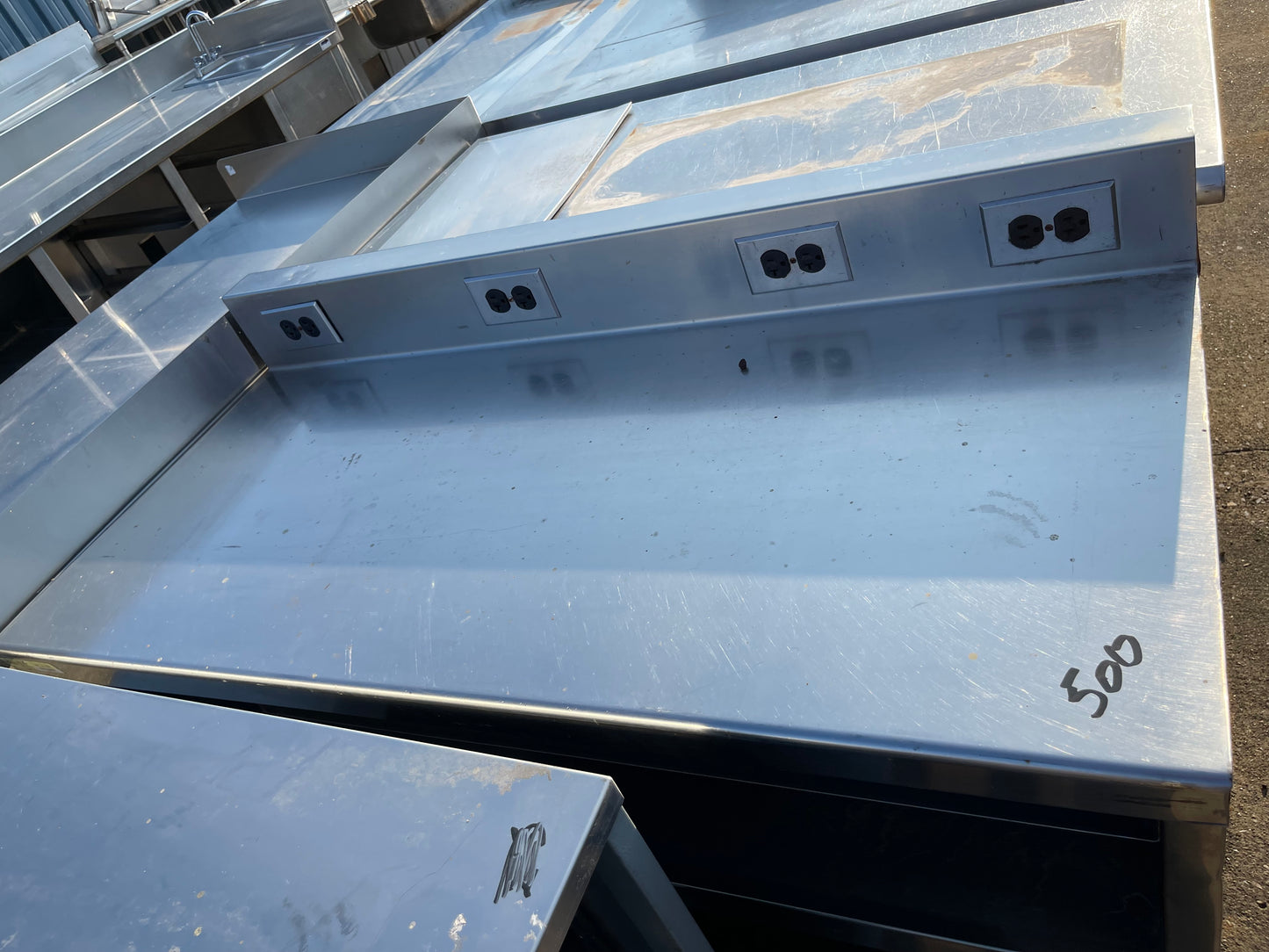 Used 48" Stainless Steel Table with Shelves and Outlets - SS181