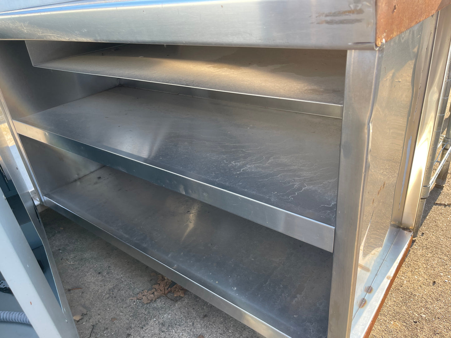 Used 48" Stainless Steel Table with Shelves and Outlets - SS181