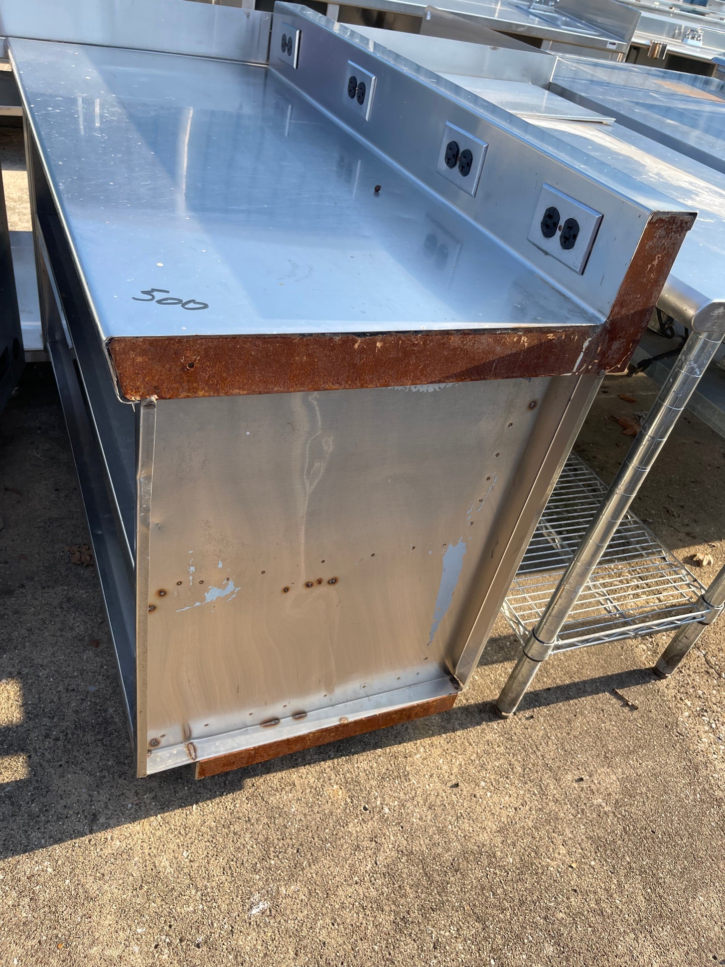 Used 48" Stainless Steel Table with Shelves and Outlets - SS181