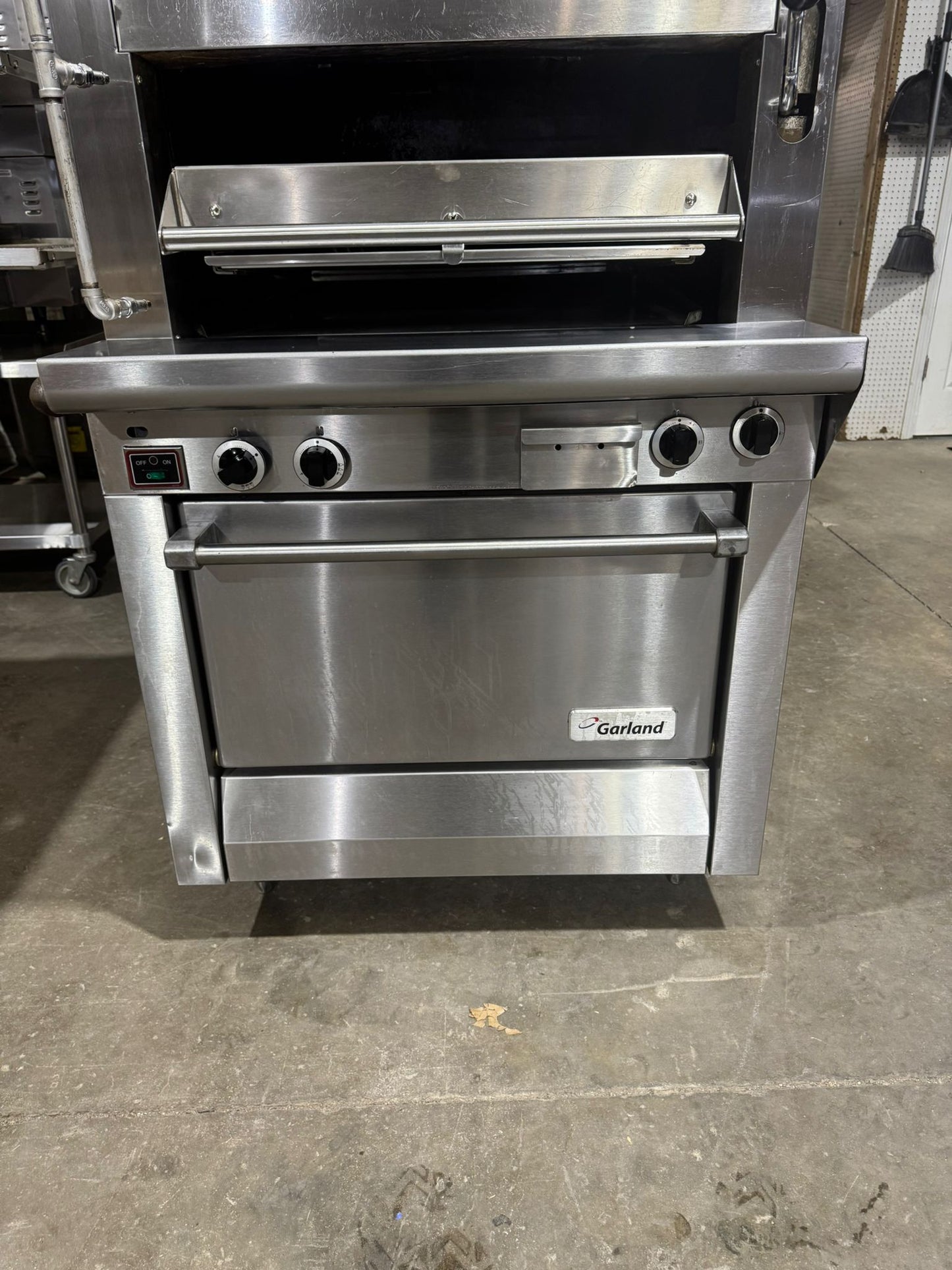 Used Garland M100XRM Upright Infrared Broiler with Standard and Finishing Ovens - 110,000 BTU NG