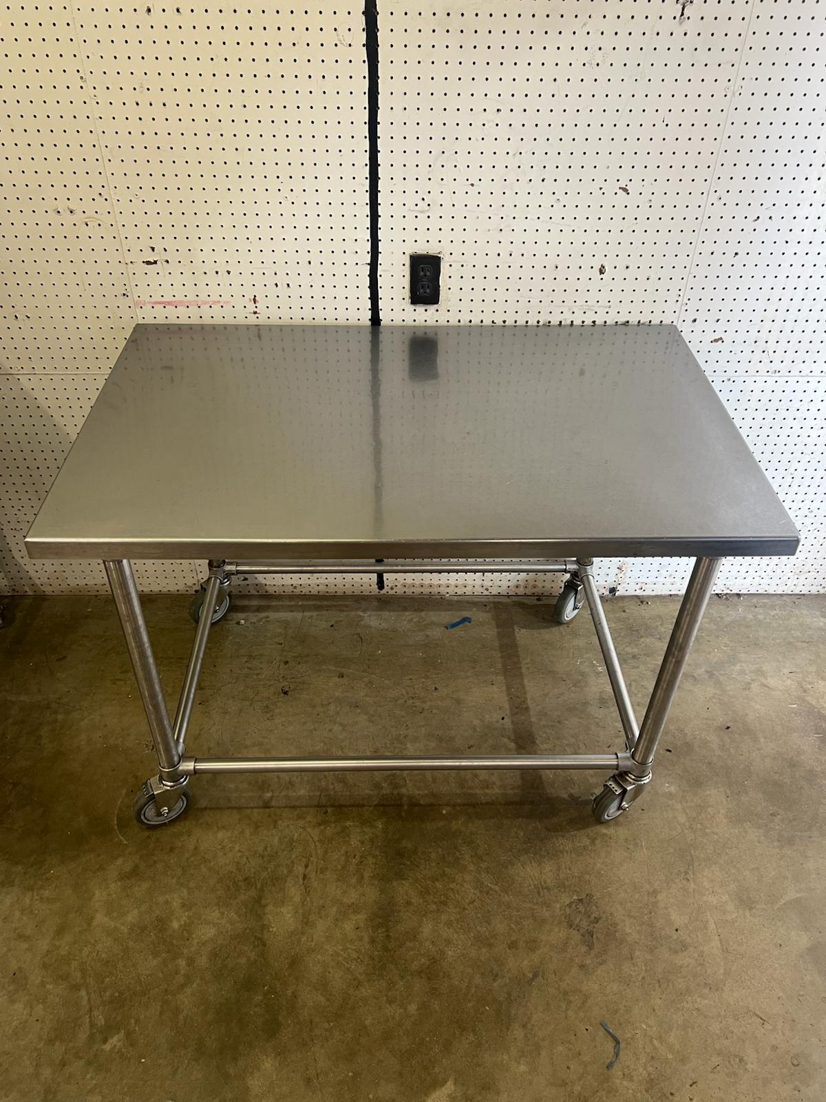 Used 48" X 30" Stainless Steel Table with Casters - WO1