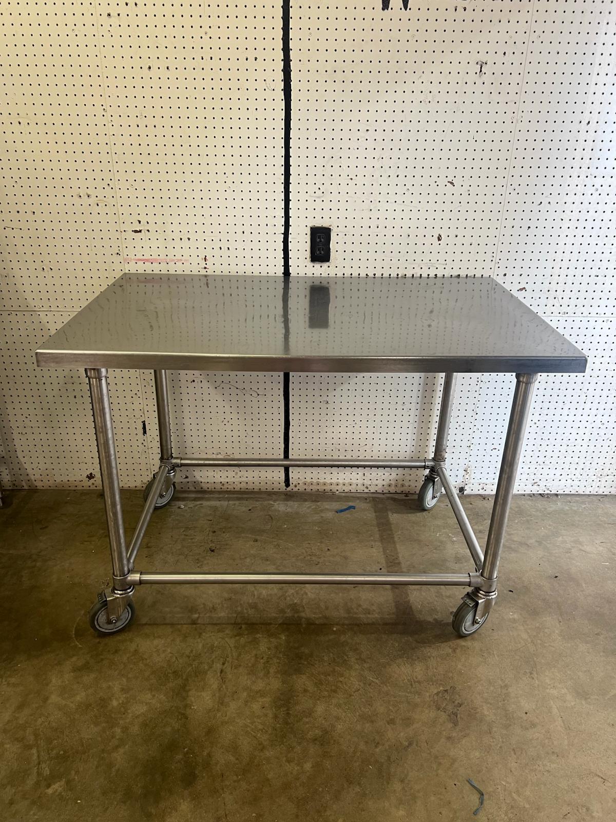 Used 48" X 30" Stainless Steel Table with Casters - WO1 - Falcon Restaurant Supply - 1