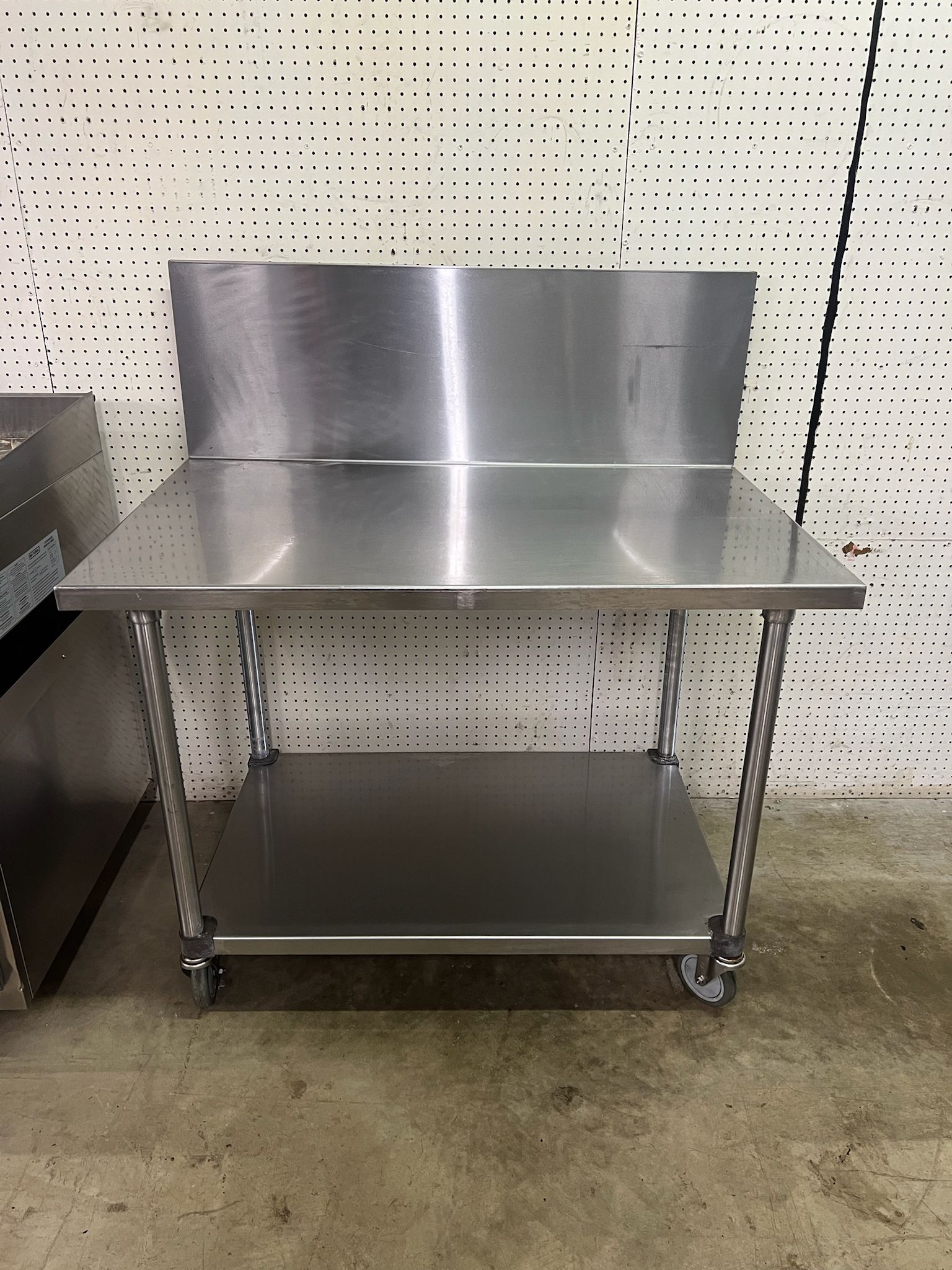 Used 48"X30" Stainless Table with 16" Backsplash on Casters - FG - Falcon Restaurant Supply - 4