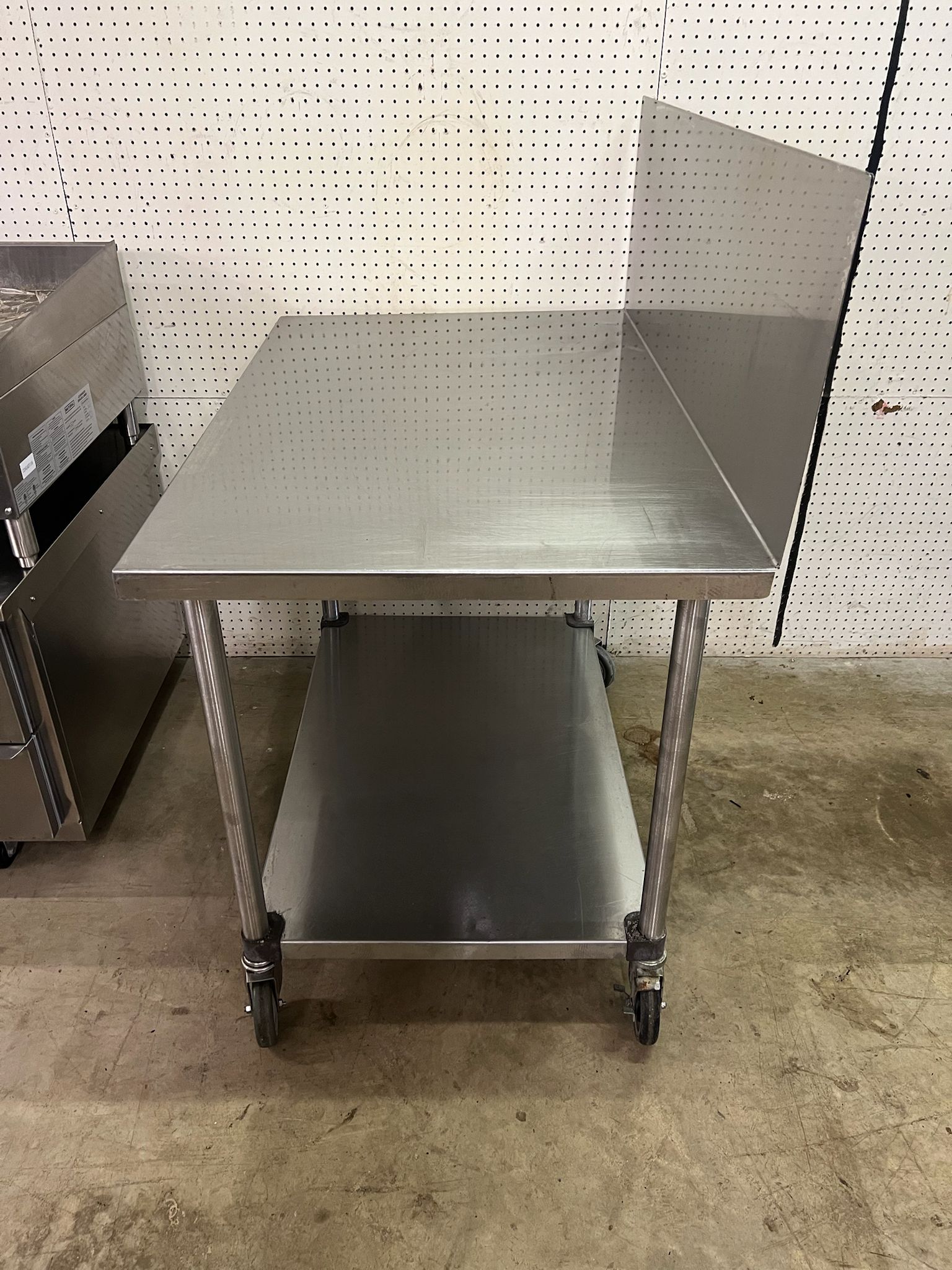 Used 48"X30" Stainless Table with 16" Backsplash on Casters - FG - Falcon Restaurant Supply - 3