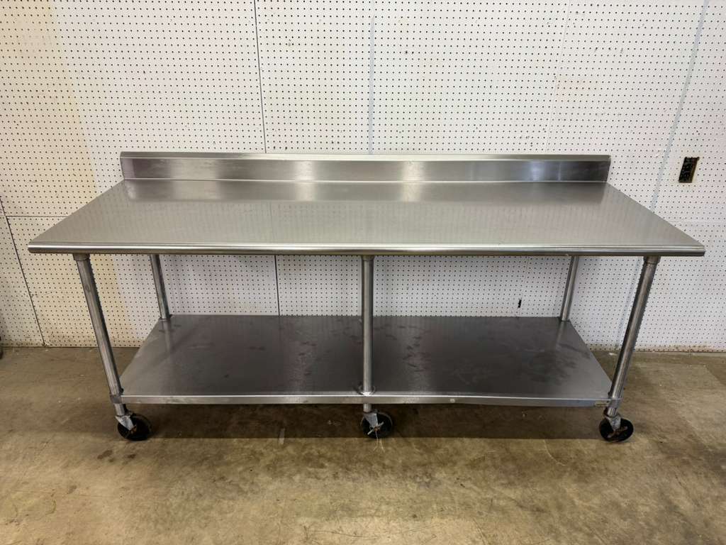 Used Advance Tabco 84"x 30" Stainless Steel Table on Casters