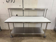 Used 72"x 30" Stainless Poly Top table with a 72"x 12" Overshelf on Casters