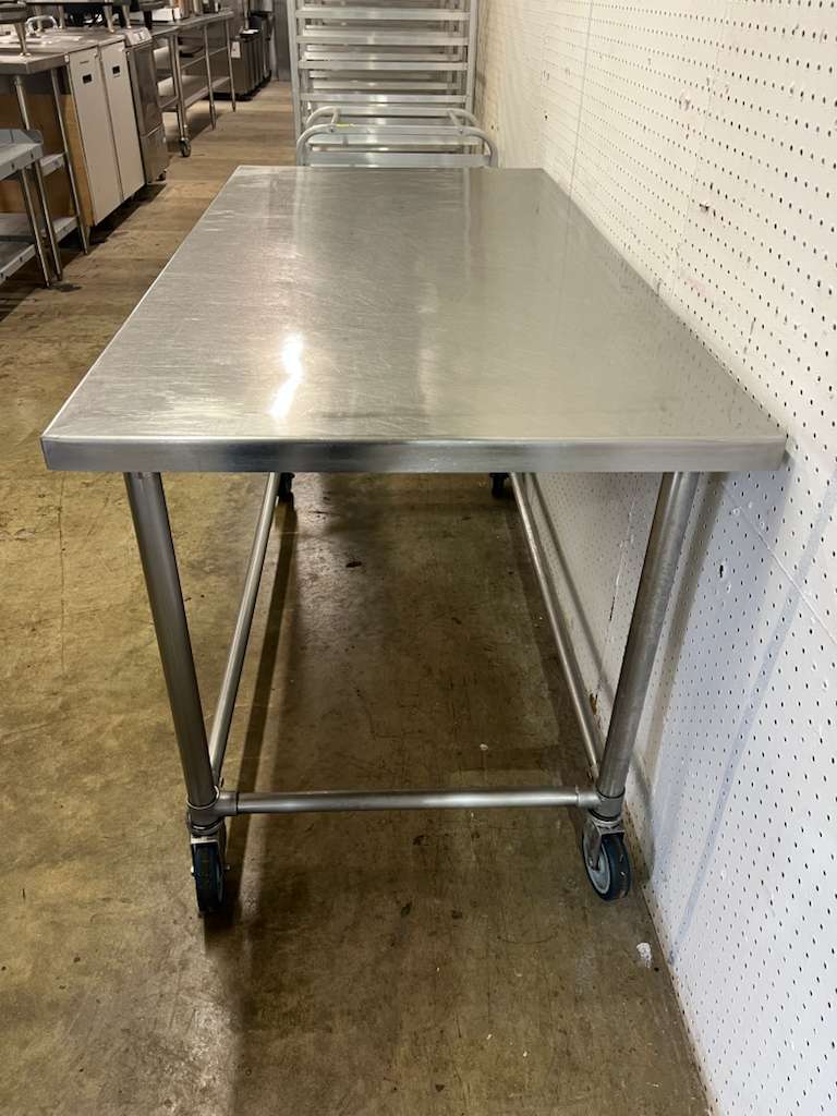 Used 60" X 30" Stainless Steel Table with Casters - FG