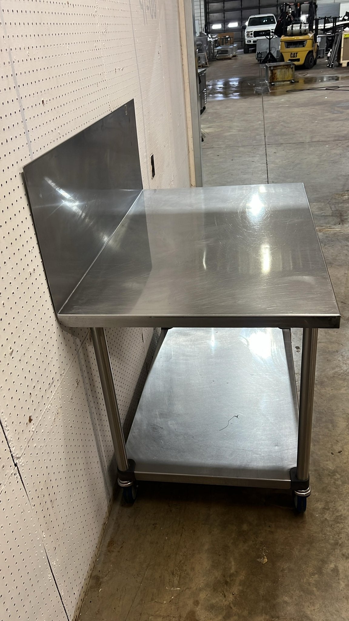 Used 48"x 30" Stainless Steel Table with Casters and a 16" Backsplash - FG - Falcon Restaurant Supply - 3