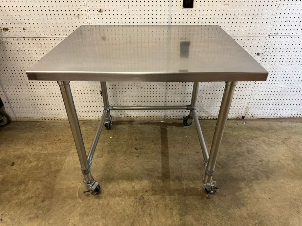 Used 36"x 30" x 31.75" Stainless Table with Casters - FG
