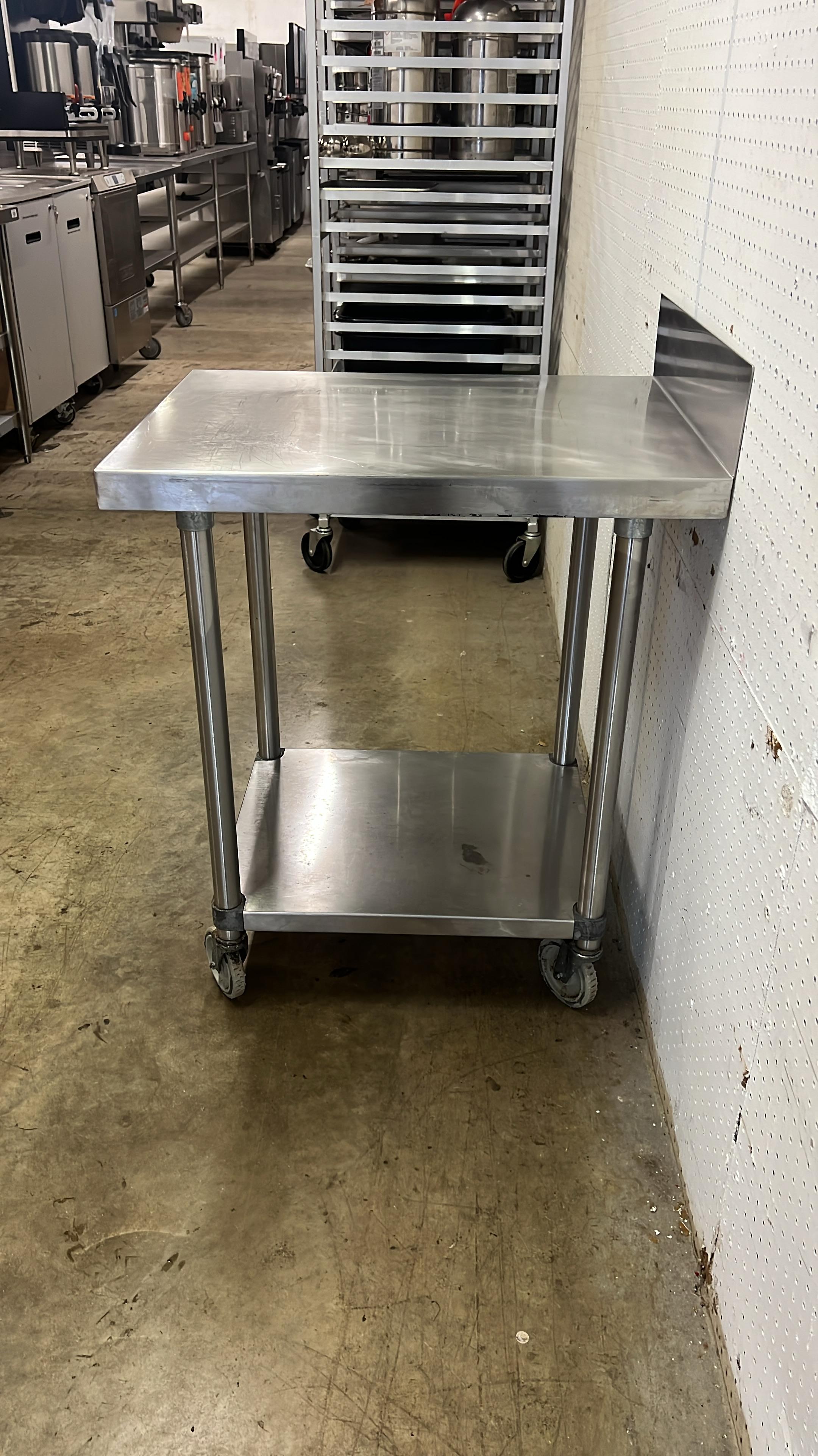 Used 24" X 30" Stainless Steel Table with Shelf and Casters