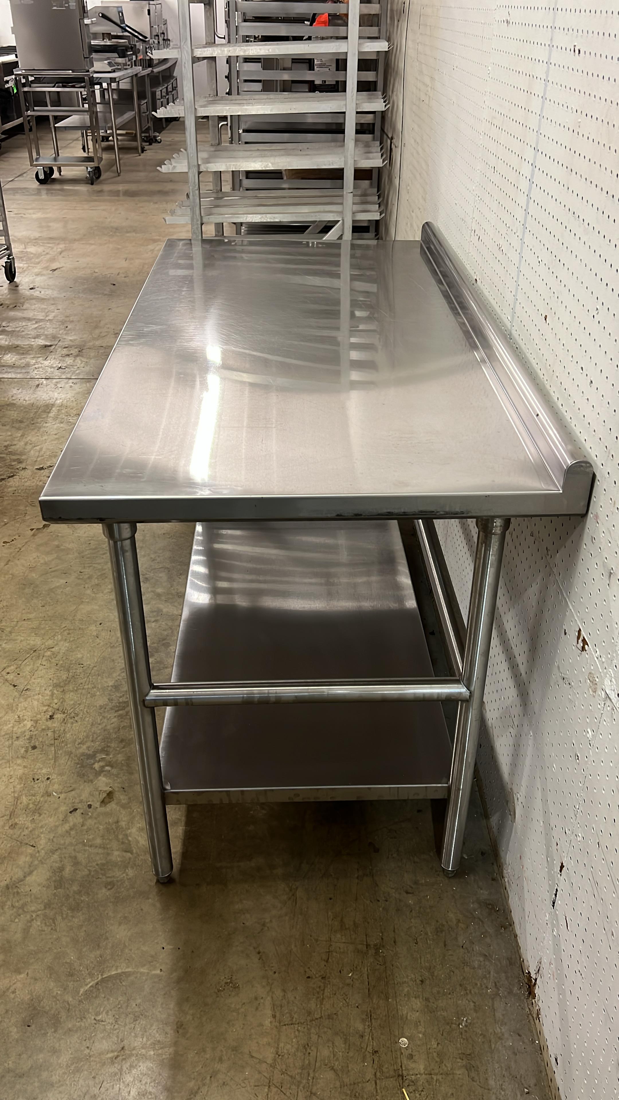 Used 60" x 30" Stainless Steel Table with 2" Back - JJ
